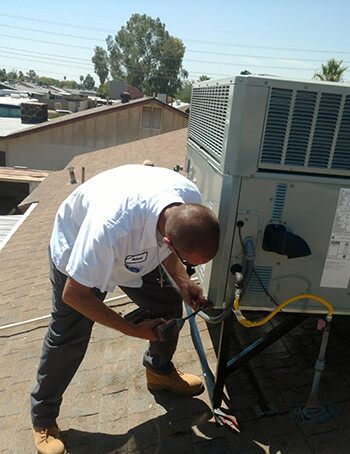 Sun City Mechanical Technician Servicing AC System